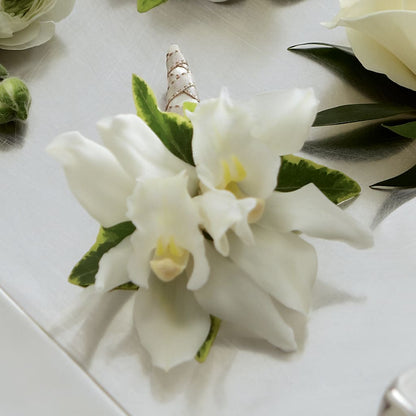 White Mini Cymbidium Boutonniere –  Serrano Flowers, Riverside CA